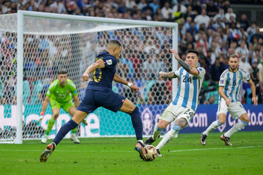 Kylian Mbappe of France and Enzo Fernandez of Argentina