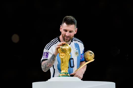 Lionel Messi of Argentina with the FIFA World Cup Trophy