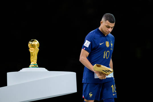 Kylian Mbappe of France looks dejected next to the FIFA