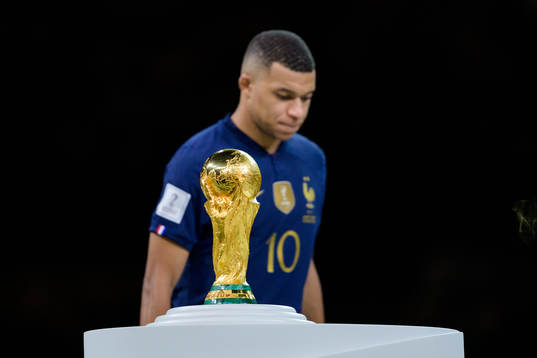 Kylian Mbappe of France looks dejected next to the FIFA