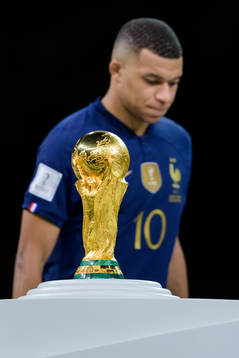 Kylian Mbappe of France looks dejected next to the FIFA