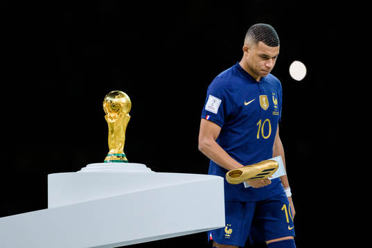 Kylian Mbappe of France looks dejected next to the FIFA