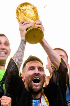 Lionel Messi of Argentina lifts the FIFA World Cup Trophy
