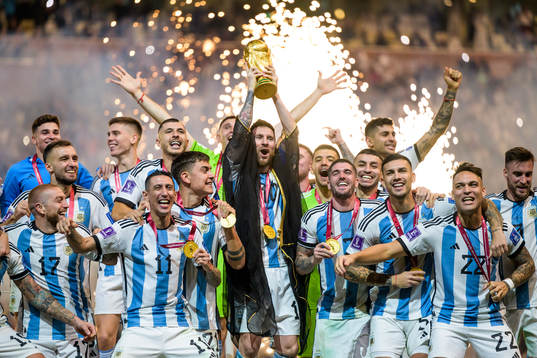 Lionel Messi of Argentina lifts the FIFA World Cup Trophy