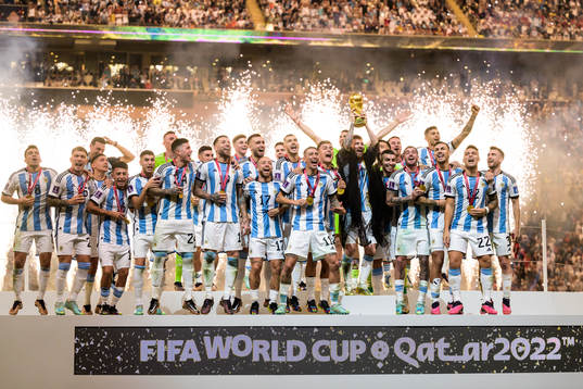 Lionel Messi of Argentina lifts the FIFA World Cup Trophy
