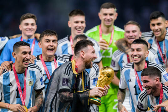 Lionel Messi of Argentina celebrates with the FIFA World