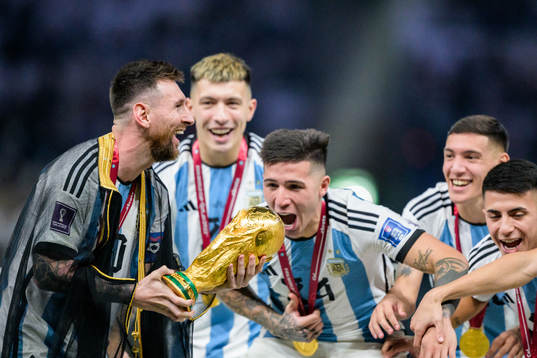 Lionel Messi of Argentina celebrates with the FIFA World