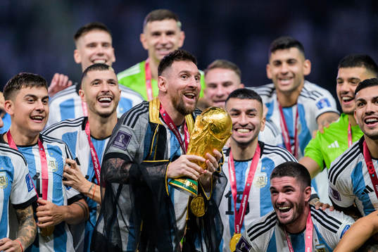 Lionel Messi of Argentina celebrates with the FIFA World