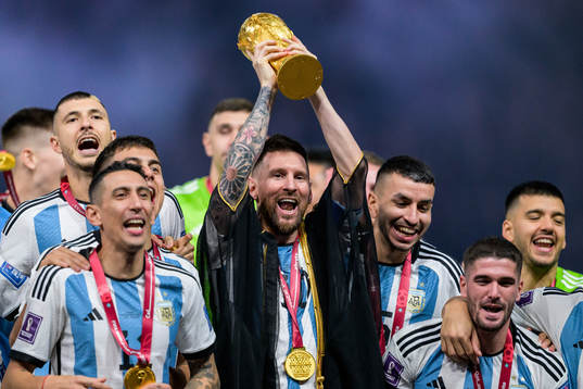 Lionel Messi of Argentina lifts the FIFA World Cup Trophy