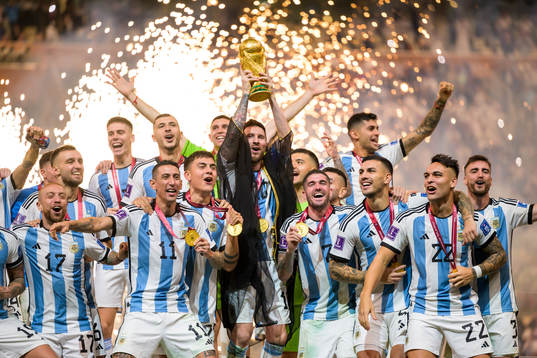 Lionel Messi and players of Argentina celebrate with the