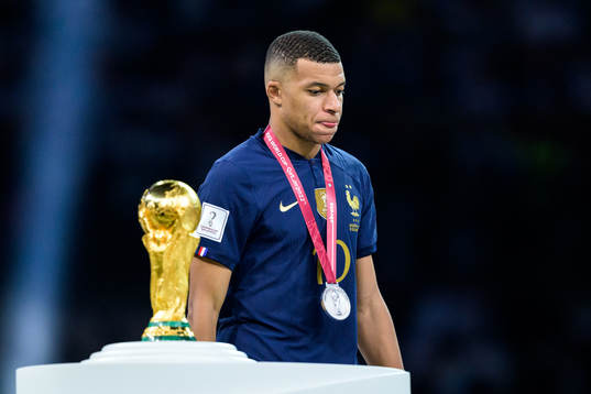 Kylian Mbappe of France looks dejected as he is passing the