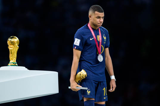 Kylian Mbappe of France looks dejected as he is passing the