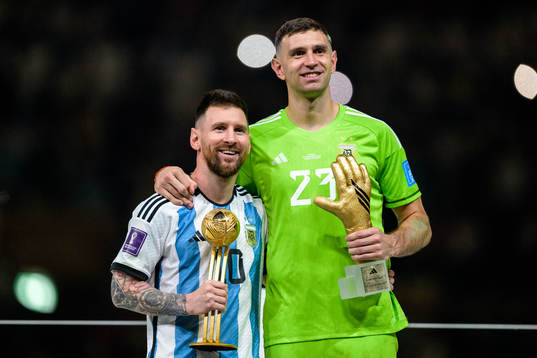 Lionel Messi and goalkeeper Emiliano Martinez of Argentina