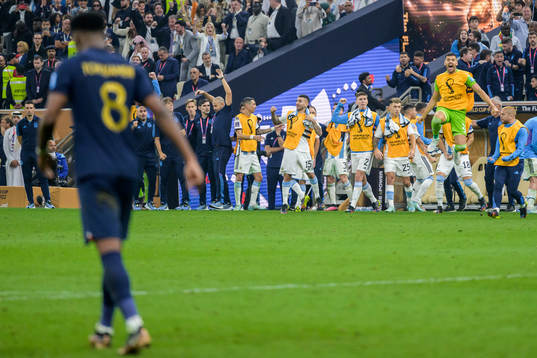 Players of Argentina celebrate as Aurelien Tchouameni of