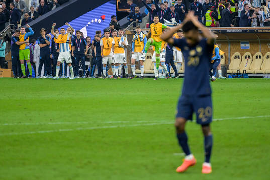 Players of Argentina celebrate as Kingsley Coman of France