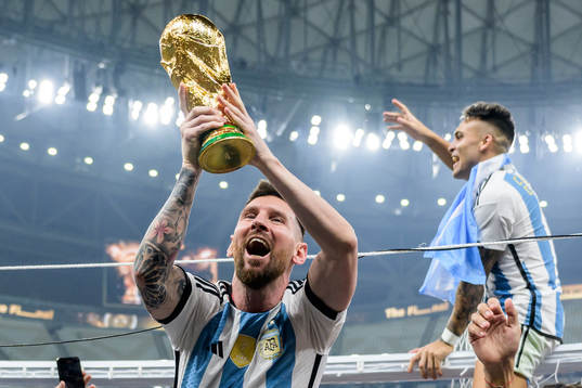 Lionel Messi of Argentina celebrates with the FIFA World
