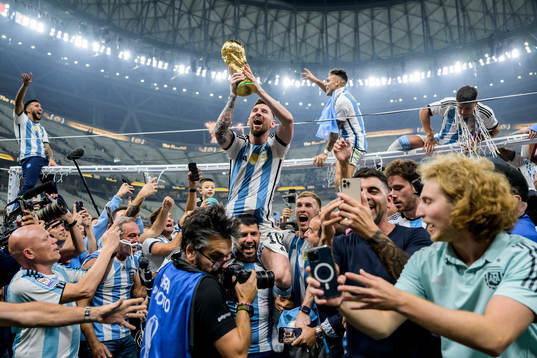 Lionel Messi of Argentina celebrates with the FIFA World