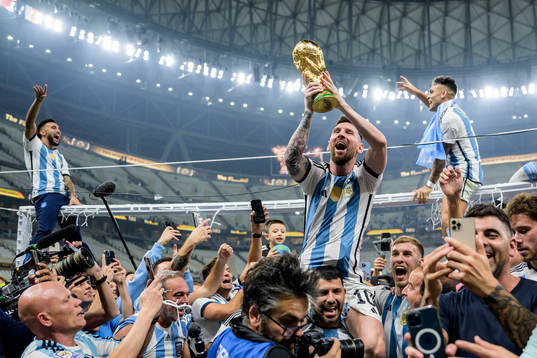 Lionel Messi of Argentina celebrates with the FIFA World