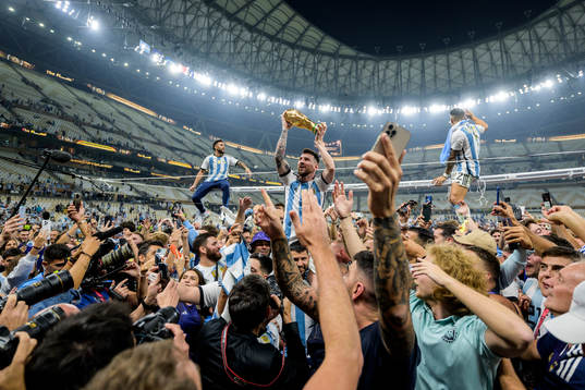 Lionel Messi of Argentina celebrates with the FIFA World