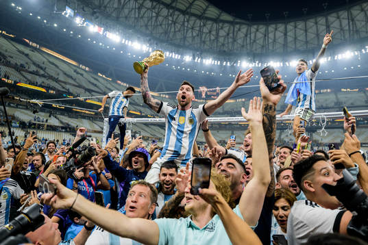 Lionel Messi of Argentina celebrates with the FIFA World