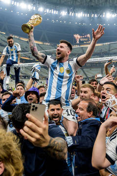 Lionel Messi of Argentina celebrates with the FIFA World