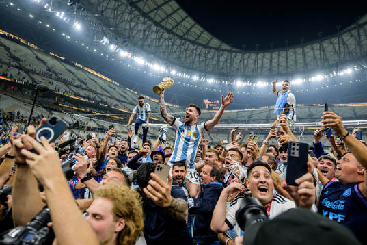 Lionel Messi of Argentina celebrates with the FIFA World