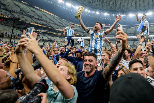 Lionel Messi of Argentina celebrates with the FIFA World