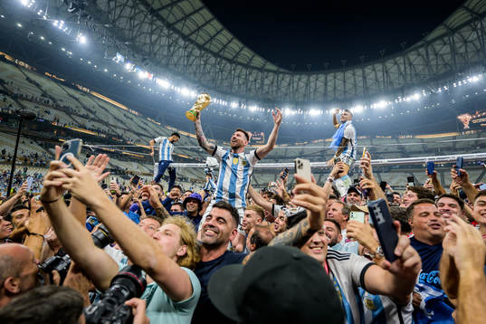 Lionel Messi of Argentina celebrates with the FIFA World