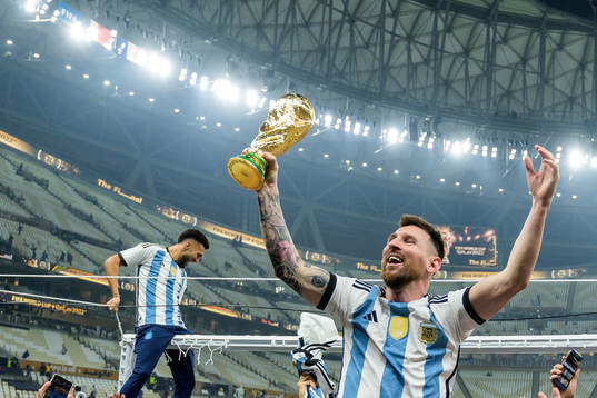 Lionel Messi of Argentina celebrates with the FIFA World