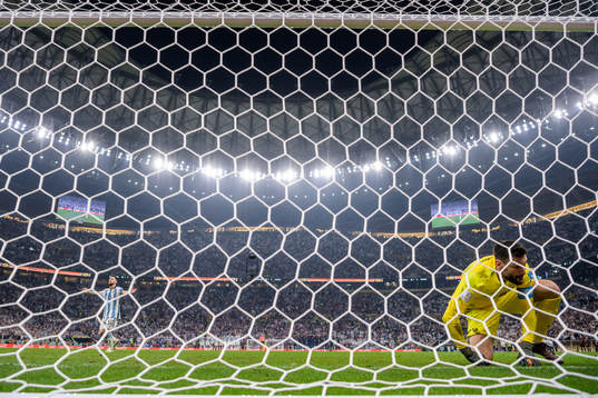 Lionel Messi of Argentina celebrates as goalkeeper Hugo