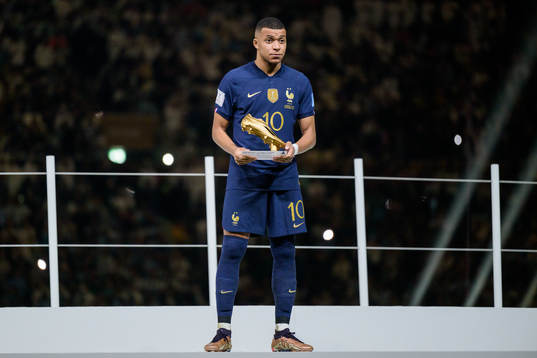 Kylian Mbappe of France with his award