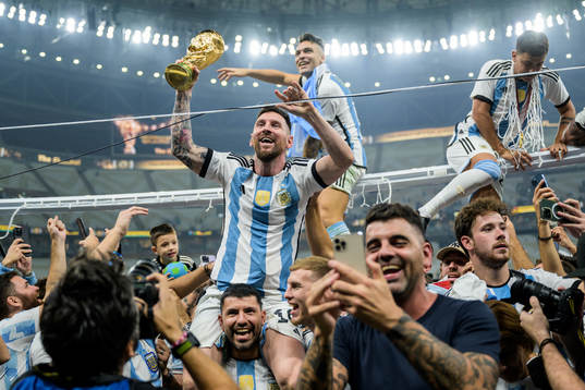 Lionel Messi of Argentina celebrates with the FIFA world