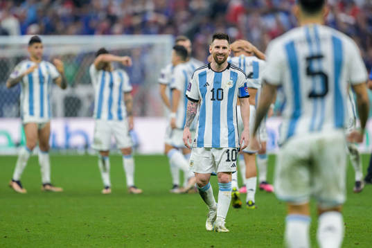 Lionel Messi of Argentina and Leandro Paredes