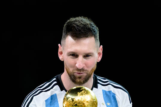 Lionel Messi of Argentina with the FIFA World Cup Trophy