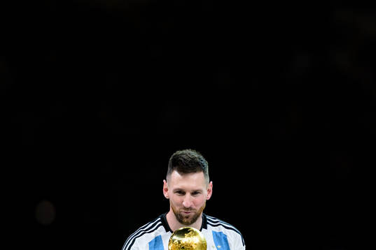 Lionel Messi of Argentina with the FIFA World Cup Trophy