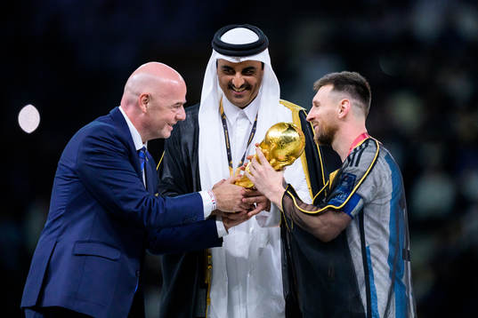 Gianni Infantino, president of FIFA, hands over the FIFA