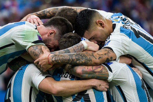 Players of Argentina celebrate the 2-0 goal by Angel de