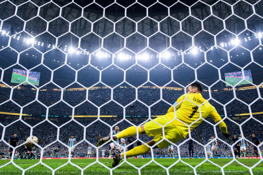 Lionel Messi of Argentina scores 1-0 behind goalkeeper Hugo