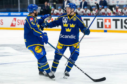 Oscar Fantenberg and Emil Heineman of Sweden celebrate