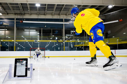 Goaltender Carl Lindbom and Filip Bystedt of Sweden