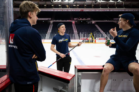 Goaltender Ian Blomquist, Elias Pettersson and goaltender