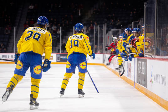 Simon Robertsson and Isak Rosén of Sweden celebrate the