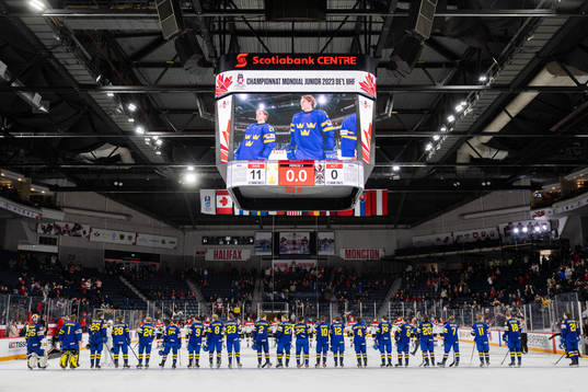 Players of Sweden celebrate the 11-0 win