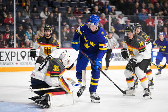 Filip Bystedt of Sweden and goaltender Nikita Quapp of