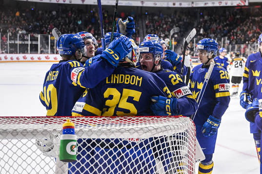 Goaltender Carl Lindbom and Victor Stjernborg of Sweden