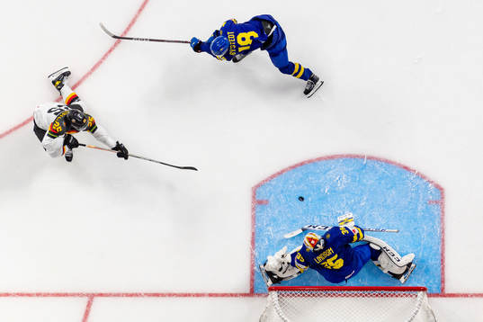 Robin van Calster of Germany against goaltender Carl