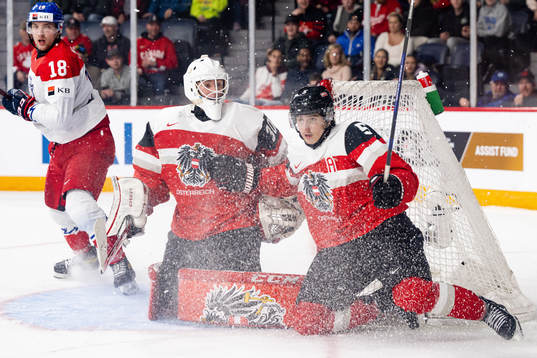 Goaltender Michael Sicher and David Reinbacher of Austria