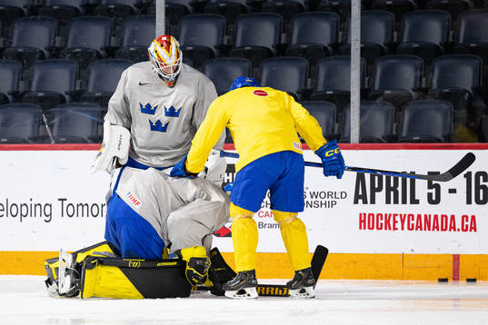 Goaltender Ian Blomquist of Sweden in pain