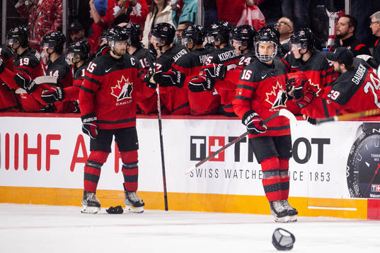 Shane Wright and Connor Bedard of Canada celebrate the 5-1