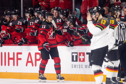 Dylan Guenther of Canada celebrates the 6-1 goal